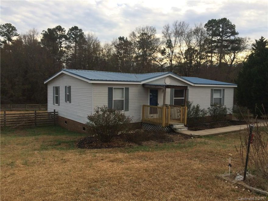 Nice country home with room to roam and fenced back yard area. Covered deck.