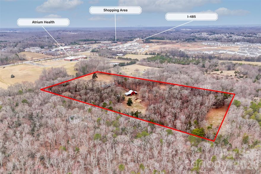 Great investment or development opportunity to purchase 16+ acres of land in Harrisburg NC right behind the Atrium Medical center on Rocky River Road. This property is zoned OI but is currently being used as a single family home with a pasture that was previously used for cattle and horses. The home is well built and is in good shape but does need updating. New roof was installed in 2023 and new HVAC was installed in 2022. This property has a lot of potential for a multitude of uses. Investors, developers, and buyers looking for acreage to spread out and have privacy yet still be walking distance to medical, shopping and dining. I-485 is less than 1/2 mile away. Call listing agent to schedule your private showing.