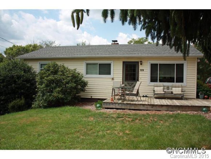 Great possibilities in the Oakley area. 3 bedroom home is situated on a larger lot in this popular area of town. You can look out over the backyard from the covered deck. Hardwood floors are hiding under the carpet. Newer windows (2009) and a new roof will protect you from the elements. Renovated homes in the area are selling for almost twice as much! Live close to Biltmore Village, Asheville Mall and all those areas have to offer.