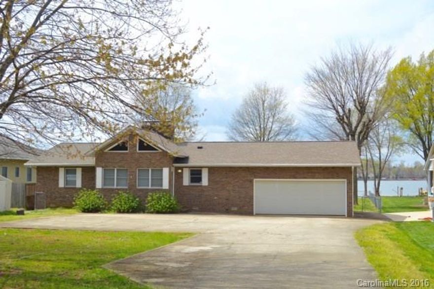 Waterfront Lake Norman home surrounded by multi-million dollar homes near The Point and Trump National Golf Course. You can see miles of blue water from the house, pier and boat dock, with some of the best views on Lake Norman.  Imagine entertaining in your spacious, open, great room and dining room.  Then, move guests outside to the rear deck or pier.  Finally, relax at day's end in your spacious Master Bedroom with private bath and walk-in-closet.  Ahhhh....what a perfect day.