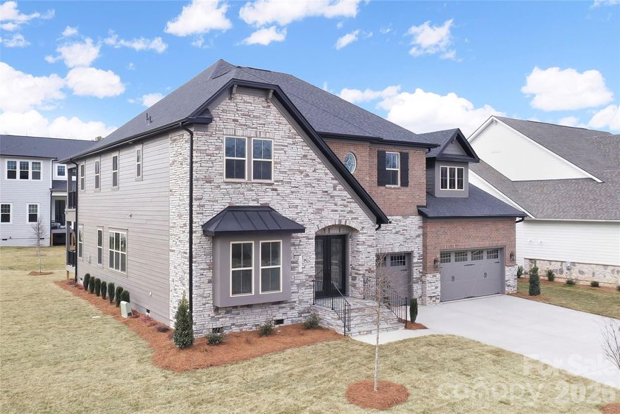 Beautiful light & bright new construction home, 6 bed/6.5 bath on a spacious corner-lot in Marvin, conveniently located to shopping, schools, & entertainment. Home has over $270K in design and structural options, including media room, rear balcony, scullery, cabinet & appliance upgrades. Welcoming two-story foyer with upgraded turning staircase, open floor plan, & primary and a 2nd bedroom (or office) on main. Upgraded kitchen features ceiling-height cabinets, built-in wine bar with beverage fridge, a commercial gas cooktop & hood, pot-filler faucet, commercial grade built-in refrigerator, wall oven, scullery area off kitchen, & large walk in pantry w/built in shelving. Upstairs find a large flex room that opens up to covered balcony & media room, 4 large secondary bedrooms all with ensuite bathrooms. Home has irrigation all around. 3 car garage, two tankless water heaters, 400 amp electrical service, security camera pre-wire, EV prewire, garage epoxy floor. Zoned to Marvin Schools. This is a great opportunity to get a brand new home in Marvin in a community that is in closeout. Not to be missed!