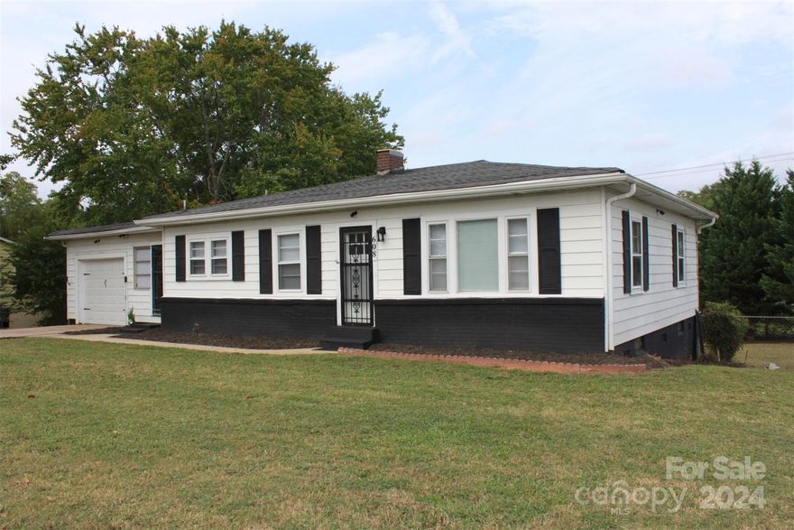 Seller Financing Option Available. Looking for a home that can also be used for a home-based business? With the correct permits, this could be it! This stunning ranch-style home features 3 bedrooms, 1 full bath and has a 13x22 sq ft attached garage. The refinished hardwood floors in the living room, hallway, and bedrooms add a touch of elegance to the space.
The bathroom has been updated w/ a new vanity, toilet, flooring, and shower surround, giving it a fresh and modern look. The kitchen and dining combo provide a functional space for cooking and entertaining.
The beautiful breezeway serves as a mud room/laundry space, w/ an extra sink and cabinetry for added convenience. The attached one-car garage offers additional storage options.
The backyard is completely fenced in, making it a private space for outdoor activities. Extra storage is available at the back of the home and underneath the crawl space. Don't miss this opportunity!