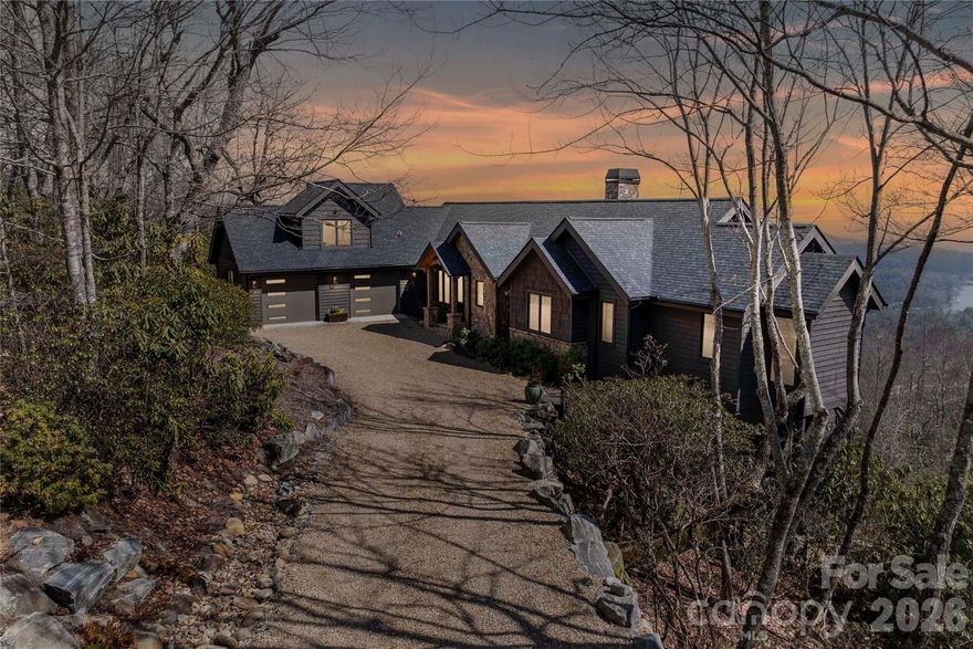 Perched within a quiet cul-de-sac in Lake Toxaway Estates, this beautifully renovated home captures the essence of refined luxury mountain living coupled with unparalleled mountain and lake views. A timber frame post-and-beam front porch with gas lantern, stone detailing, and Andersen French steel and glass entry doors creates a warm, elevated welcome. Having gone under an extensive transformation some exterior improvements include, new cedar shake siding and trim, a 30-year roof, new gutters, stone chimney, and a freshly painted exterior. Thoughtful updates are evident through the whole home.The primary bedroom features two renovated bathrooms and expansive closet space, with the laundry discreetly tucked within for added convenience. Notably the main level highlights a reimagined open floor concept with a fully equipped chef’s kitchen featuring a Sub-Zero refrigerator and a La Cornue range. The property has been extensively improved with a pea gravel and flagstone driveway, refined landscaping all designed to focus on the breathtaking long-range views. Also a refreshed guest apartment is located above the double bay enclosed garage. Truly a turnkey opportunity offering polished mountain luxury in one of Lake Toxaway’s most desirable settings. Membership to Lake Toxaway Country Club is based on application and availability.