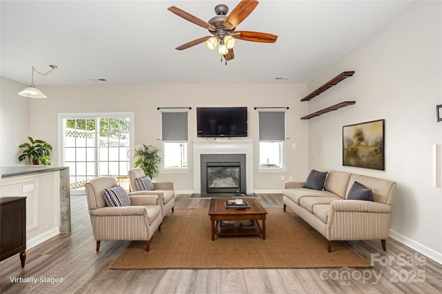 Nestled in the heart of Clover, SC, this beautifully appointed 2-bedroom, 2.5-bath townhouse blends modern sophistication with cozy charm. The updated kitchen shines with stunning waterfall granite countertops, ideal for both everyday meals and entertaining. The open-concept living area features a welcoming fireplace, perfect for creating a warm and inviting atmosphere. Upstairs, a versatile loft area offers flexible space for a home office, playroom, or relaxation zone. The two spacious bedrooms share two well-designed full bathrooms, with an additional half bath for guests. A fenced-in backyard provides a private oasis for outdoor activities, pets, or gardening. Complete with a 1-car garage, this move-in-ready townhouse offers style, comfort, and low-maintenance living in a sought-after location.