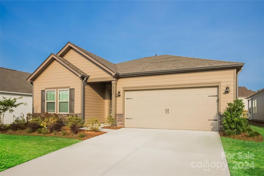 Welcome to this lovely ranch home, situated in the Canopy Creek Community! You are first greeted by an expansive foyer that leads to an inviting open floor plan, designed for effortless entertaining & everyday convenience. The gorgeous kitchen is complemented by a center island with bar seating, stylish lighting, & SS appliances including double ovens with gas cooktop. The sliding glass doors flood the dining area and entire living space with natural light. Laundry room off the 2-car garage offers a practical drop zone. The neutral color palette allows for a versatile backdrop. Sizable primary bedroom boasts a tray ceiling with ceiling fan, walk-in closet, & an ensuite bath featuring dual sinks, tile shower, & linen closet. Secondary bedrooms are nice sized & share the guest bathroom, offering a single vanity & tub/shower combo! This home's prime location offers low county taxes & proximity to shopping, dining, & amenities of Denver, including Lake Norman & Verdict Ridge Golf Course!