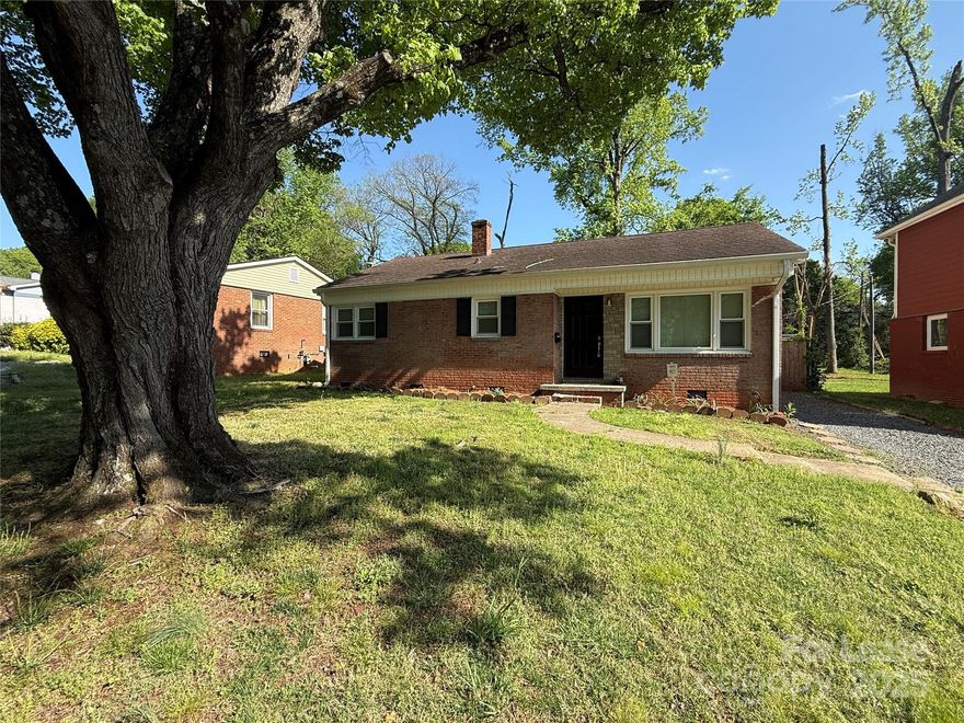 Great home close to uptown/Southend. Come home to this freshly renovated 1960's ranch home. Beautiful original hardwood floors throughout, updated kitchen with white cabinets, granite counter tops and stainless steel appliances. Lovely nostalgic pine wall bedroom perfect for office or lounge room as well. Primary bedroom has large private bathroom with double vanity. Additional bedroom and common hall bathroom. New rear deck partially covered for morning coffee or evening lounging with a large fenced in yard, Walk to light rail, Panthers Stadium, and all that Southend has to offer. Pets are conditional and must be approved. Washer and Dryer remain as a convenience only.