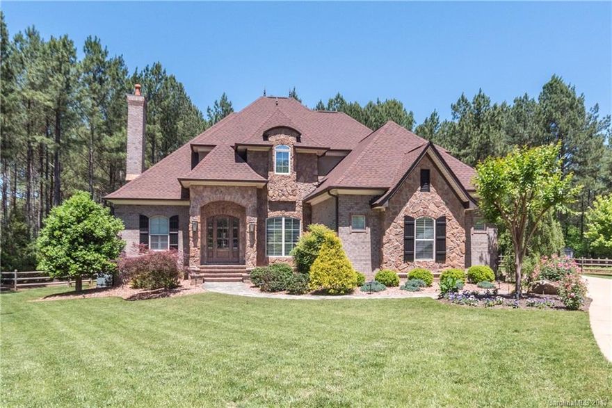 This stunning home in Windswept Cove is absolutely breathtaking! Brick & incredible stone work abounds along with impeccable landscaping! This home is custom defined! MasterBR on main! Chefs kitchen, island w/sink & gorgeous granite! Office, beautiful hardwoods, and the list goes on! Enjoy your amazing covered back patio with tons of room for entertaining! This home has absolutely been loved and it shows! Award wining Clover Schools and just minutes to the shores of beautiful Lake Wylie SC!