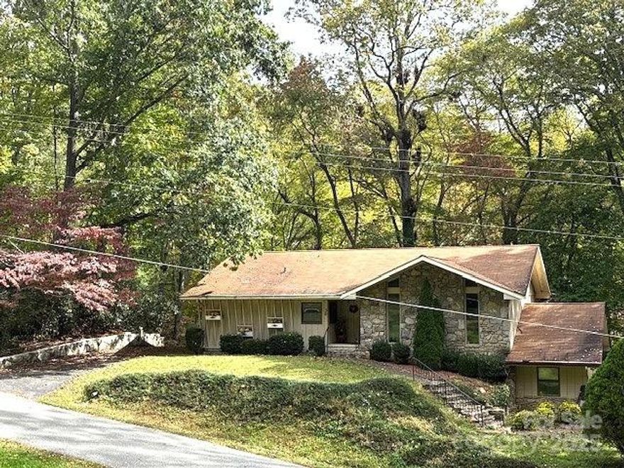 LOCATION...LOCATION...LOCATION...next-door to the Maggie Valley Club; the golf course and Pin High Bar & Grille are open to the public. Optional membership opportunity includes...golf course, golf driving range, tennis, pool, fitness center, restaurant, events facilities. Short term and long-term rentals are allowed. This home is suitable for year-round, seasonal/vacation usage. Access this home year-round with all-paved roads approach. Lovingly used by current owner since 2004. This home offers so much potential and investment opportunity; come see how you can make it your own! Floorplan offers open design with a comfortable & roomy feel; good sized rooms. Room measurements are included in this MLS listing information. Built-in cabinets and shelves in several rooms. A large multi-purpose room in the lower level could be used as a family room, office, exercise room, hobby room, etc. During warmer months, sit out on the covered back porch & enjoy the peaceful treescaped setting; there is a fireplace for those cool nights. Come inside & cozy up to the wood-burning stove/fireplace on those chilly days/nights. Newer central heat and air conditioning system is in this home. The lower driveway leads to ample parking area, garage for parking multiple vehicles and a golf cart; also includes workshop, "safe room", and green house/plant room. The upper driveway leads to next-to-main-level parking and level entry into home. Detached storage shed in the back yard for your outdoor tools. Located close to the heart of Maggie Valley, Waynesville, Cataloochee Ski Area, Blue Ridge Parkway, Great Smoky Mountains National Park, & Harrah's; 30 minutes to Asheville. Nearby you'll find restaurants, shops, entertainment, outdoor activities, & major roadways.