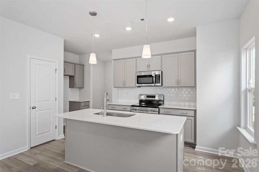 This beautifully designed townhome offers three spacious bedrooms, two-and-one-half bathrooms, and an open-concept layout perfect for modern living. Upstairs, the luxurious primary suite features a generous walk-in closet and a private ensuite bath complete with a walk-in shower, dual vanity, and sleek contemporary finishes. Two additional bedrooms and a full bath provide flexible space for loved ones, guests, or a home office.