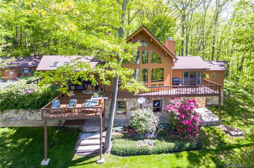 Custom built home above 4500 foot elevation! Total privacy awaits with over 7 acres, much of which is almost level & park like! The home is downright gorgeous! Huge, open Great Room with lots of glass to bring in some of the nicest views around. Double sided fireplace in the Great Room & Kitchen. The kitchen is set up for entertaining & opens to the covered & open deck. The master bedroom is suited for royalty. Lots of closet space & an elegant master bath. Detached 2 car garage w/ workshop.