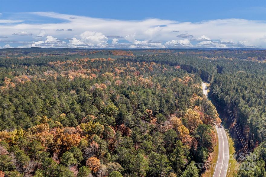 Spacious +/- 14.5 Acres in the highly desired Lake Wateree area! With a Ridgeway address, you will be minutes away from Colonel Creek Landing (Lake Wateree access), gas stations, Lake Wateree Park, and other modern amenities! Easy access to HWY -21, I-77. Private wooded lot for your custom dream home. If you are looking for a peaceful homesite, this is the land for you! About 900' of road frontage which creates easy access. There are electrical utilities and internet available at the street.  With the large lot size, pursue building your dream home, use this land for your small farm/garden or recreational actives. *Subject to Survey* * More land Available for Sale*.