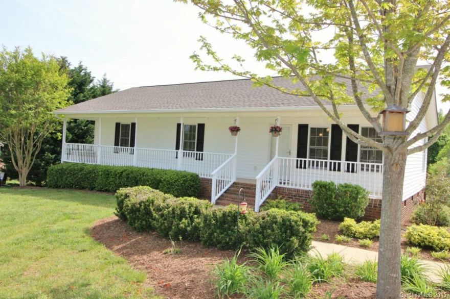 Truly a Pinterest worthy home!  Enjoy the breeze from the huge rocking chair front porch!  Wide plank laminate floors and cozy colors invite you in through the front door!  Open floorplan allows you to entertain from the kitchen to the living room and dining room!  Kitchen offers butcher block counters, custom cabinets and bead board backsplash! Master suite overlooks the private fenced in back yard!  2nd and 3rd bedrooms have Berber and large closets and a bonus room on the main to boot!