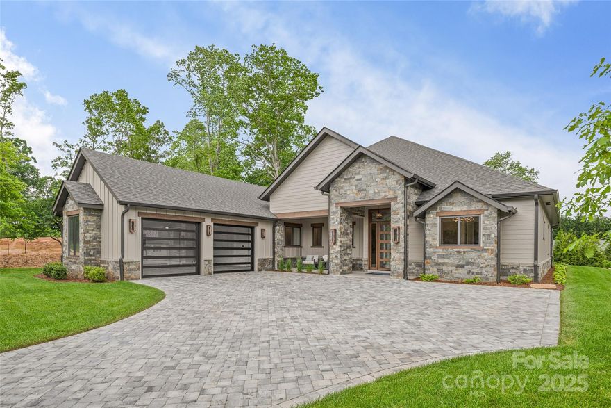 Fabulous one-level living in coveted Cove Park in The Cliffs at Walnut Cove with mountain views! Designed with convenience in mind, this well-appointed new construction home is dressed to impress with beautiful finishes! The flow of this brilliant open floorplan invites you to come in and leave the rest of the world behind! Gracious entertaining is easy from your gourmet kitchen with abundant storage, waterfall island, and hidden walk-in pantry! The Wellness Center, pools, tennis court and walking trails are just steps away, and just a short drive to club dining and the Jack Nicklaus Signature Golf Course! With easy access from the Misty Valley security gate, you will be close to all the wonderful sites, shops and restaurants that Asheville has to offer. Enjoy a lock-and-go lifestyle or settle in for year-round living! Come experience the thrill of the modern mountain retreat and become a part of this vibrant community that is ready to welcome you home!  Membership available.