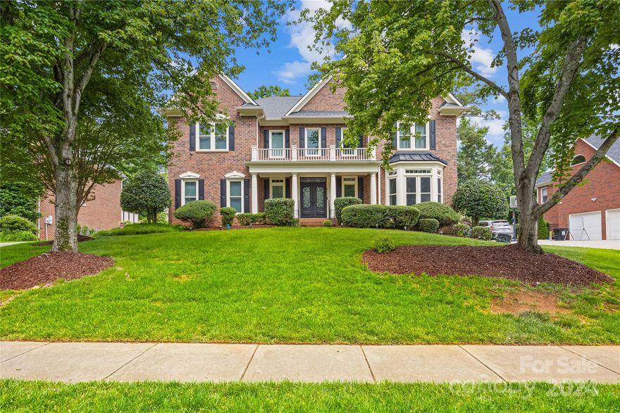 Beautiful full brick 3 story home in sought out Deerfield Creek. Grand foyer opens to formal living & dining rooms featuring high end flooring throughout main level, soaring 2 story Great Room w/ built ins & gas fireplace, impressive kitchen w/ white cabinetry, island, granite countertops, stainless-steel appliances including Wolf gas range/oven plus additional wall oven, microwave, dishwasher, refrigerator. Unwind in the XL lovely screened in porch w/ coveted fire-resistant protection, outdoor kitchen w/ gas grill, separate burner, fridge, countertop overlooking amazing firepit, stamped concrete patio & fenced backyard. Upstairs you will find an expansive primary suite w/ trey ceiling and ensuite bath, dual walk-in closets, 2 vanities, large tub w/jets, walk in shower, office w/ built ins, 3 secondary bedrooms, one w/ built in Murphy bed & all w/ direct bath access. Huge 3rd floor w/ 5th bedroom, full bath, rec/media room etc.