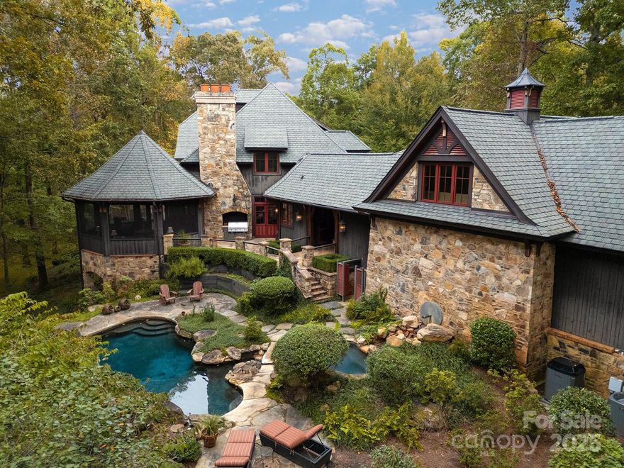 Private, poised, and perfectly suited inside the coveted Golden Hills & Greenspace communities, this exceptional 94.5-acre estate pairs refined architecture with sweeping privacy and open land. for the lifestyle you’ve been seeking. Set on nearly 95 acres within both the Golden Hills & Greenspace communities, this estate commands both setting and structure.

The 8,424 sq ft main residence reflects timeless craftsmanship, with stone and wood detailing, generous natural light, elevator, and multiple levels of thoughtful, livable space. Designed with equestrian ambition and refined living in mind, the property includes an 7-stall barn, fenced pastures, and access to the community’s private riding trails.

A 3,000 + sq ft guest house offers complete independence for family, guests, or staff. Along the Pacolet River, a long stretch of scenic frontage offers the perfect place for fishing, swimming, picnics, or quiet reflection by the water.

Golden Hills & Greenspace are among the Foothills’ most sought-after communities, celebrated for its privacy, preserved open land, and proximity to Landrum, Tryon, shopping, hospitals and the region’s premier equestrian venues. This location offers an easy drive to Greenville, Asheville and Charlotte.