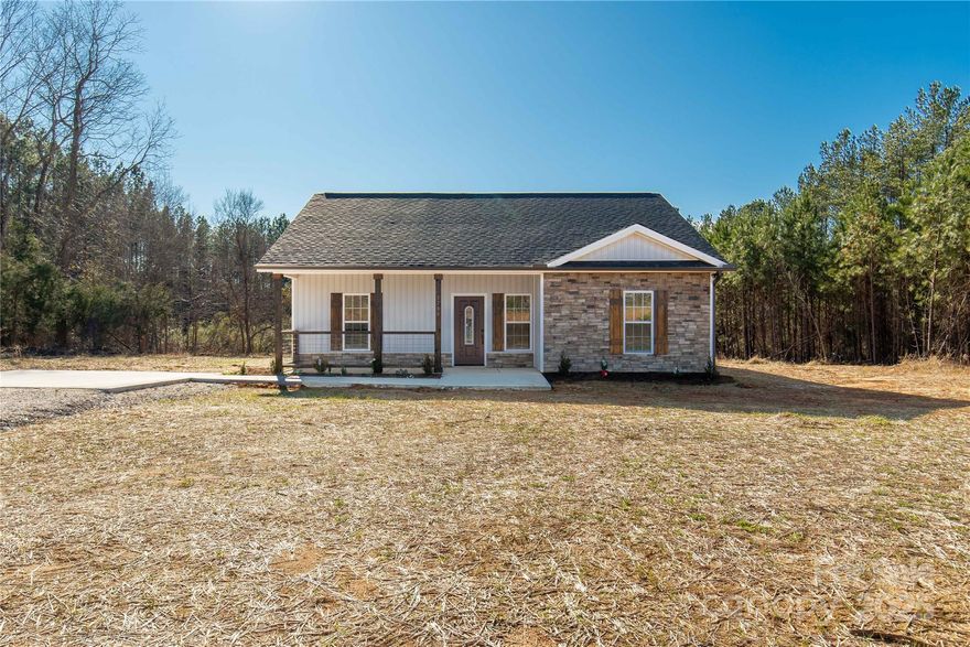 Discover the charm of this brand-new home nestled on 2 peaceful acres in a serene rural setting. Offering 1,367 sq ft of thoughtfully designed living space, this 3-bedroom, 2-bathroom home boasts modern elegance and timeless features. The heart of the home is the stunning kitchen, complete with granite countertops, a spacious island, and an open flow to the living area, where beautiful wood-beamed ceilings create a cozy yet sophisticated ambiance. The durable and stylish LVP flooring throughout ensures low-maintenance living, perfect for any lifestyle.
Relax or entertain on the covered back porch, where you can take in the tranquility of your surroundings. The home's charming curb appeal is enhanced by tasteful stone accents on the front elevation.
Whether you're looking for a quiet retreat or a space to call home, this property delivers on style, comfort, and privacy. Don't miss your chance to own this rural gem-schedule your showing today!