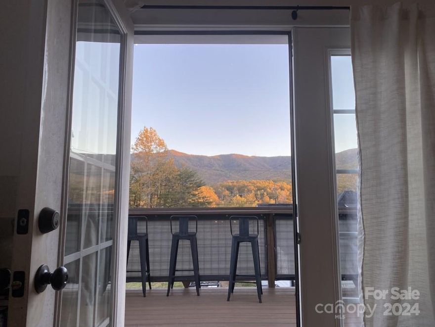 Beautiful mountain views, close to downtown Black Mountain. Unfinished basement and plumbing already installed in slab. Easily finish the lower level for larger family room, full bathroom, and extra bedroom. The corner of basement is plumbed for wet bar or mini kitchen. You could keep the bottom half separate to create an income renting. OR create your own art studio/workshop. Superior walls built the lower level, the top level was constructed as one whole house stick built modular with 6-inch studs, making for one solid structure. Each room has its own mini split. The second bedroom has a large loft 8X12. The yard is partially fenced. There is parking for 3 vehicles behind the house and 1 on the side. Appliances stay including washer/dryer, stove/oven, refrigerator, 6 bar stool chairs may also stay, they are perfect for the bar top around the edge of the deck. You get great sun with full southern exposure and could easily make a great garden.