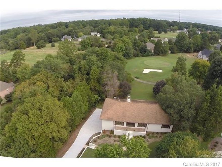 NO APP FEES! MUST SEE!! Golf course view of 10th green thru 2-story wall of windows! 3653 s.f, 4 BR + bonus (or optional 5th BR-no closet) 3 full baths. NO HOA. 2-story great rm w/floor-to-ceiling stone hearth & incredible views! Lg patio faces course. Kitchen w/granite & SS apps. Hardwoods in most of home. Raised dining room w/gorgeous travertine floor. Office has view of 10th green. Master BR has stone FP & its own balcony overlooking the course. 4 BRs w/walk-in closets. 3-car side-load garage