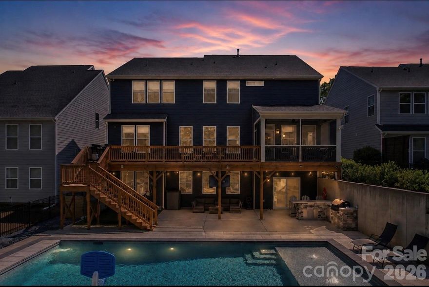 The one you have been waiting for! Stunning 2-story home with a fully finished walk-out basement featuring 6 bedrooms and 5 full bathrooms, perfectly positioned at the end of a cul-de-sac with no neighbors in front or behind for ultimate privacy. Enjoy direct access to the neighborhood trailhead entrance creating a peaceful setting. The gourmet chef’s kitchen features quartz countertops, a designer tile backsplash, butler’s pantry, under-cabinet lighting, stainless steel appliances, gas cook-top, and upgraded lighting. 
The spacious primary suite offers a true retreat with dual walk-in closets and a luxurious ensuite bath featuring separate his-and-her vanities, a large garden tub, and an oversized walk-in shower.
Guest suite on main level with full bath. 
Built for entertaining, the backyard showcases an incredible heated saltwater pool installed in September 2025 featuring a CoverMatic automatic pool cover with lock and key, over 30 feet in length, and an oversized 7’ x 15’ tanning ledge. The outdoor entertaining area includes a bar area, refrigerator, gas grill space and custom under-deck ceiling with built-in draining, allowing you to enjoy the outdoor rain or shine. This rare combination of luxury, privacy, and outdoor living is hard to find. Additional upgrades include a tankless water heater and separate HVAC units for each level — basement, main floor, and second floor — providing enhanced comfort and efficiency throughout the home. 
Prime Fort Mill location is just minutes from I-77, Charlotte, Ballantyne, and Uptown. Situated in a top-rated school district and close to shopping, dining, and parks. This amenity-rich community features a clubhouse, fitness center, playground, two outdoor pools, walking trails, paddle sport launch, Catawba River access, and so much more!
