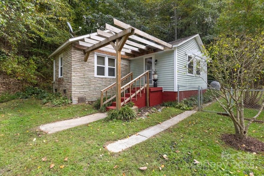 Discover peaceful country living just 5 miles from Hot Springs and the Appalachain Trail and 10 miles from Marshall with easy access to Asheville. This home is perfect for first time home owners, a rental or second home in the mountains. This charming bungalow offers many recent updates. New electrical box, plumbing and hot water heater installed in 2024. This home has beautiful wood floors, stainless appliances and a cozy gas log fireplace.