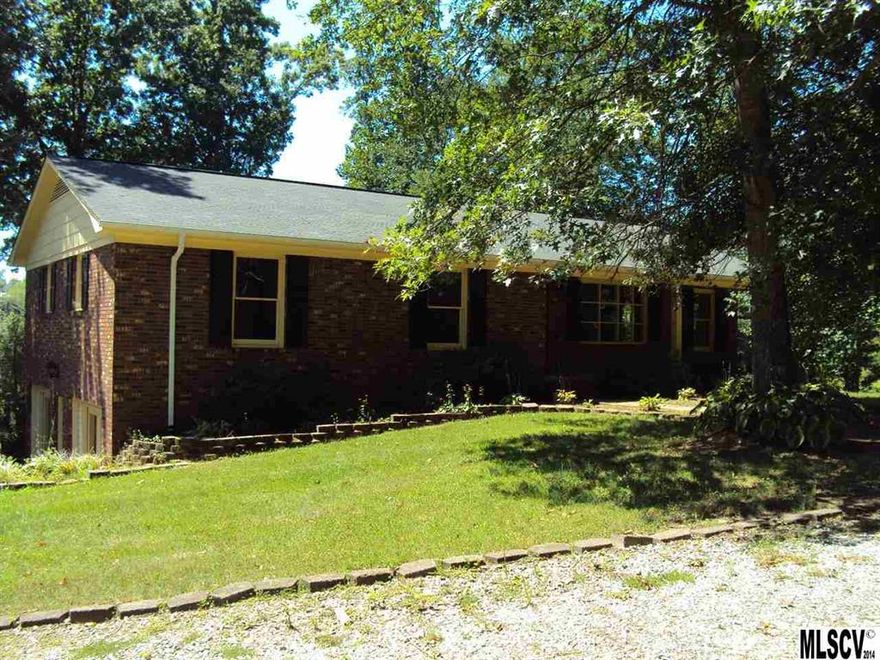 Brick ranch with full finished basement. The home offers three bedrooms with  three full baths. Two wood burning masonry fireplaces. The kitchen has an abundance of cabinets with granite tops. Nice large screened porch. The lower level offers a nice big family room. A great spot for entertaining. Lots of space for the money.