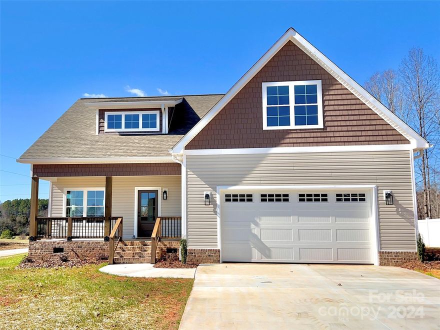 Charming custom new construction home in Archer's Ridge! Beautiful 4 bedroom, 2.5 bath home with a home office!! Spacious home with 9 foot ceilings on the main level, luxury vinyl plank flooring and a bright and open floor plan! Beautiful kitchen with custom cabinetry, quartz countertops, oversized island with bar seating and a large pantry. Frigidaire Gallery stainless steel appliance suite includes a stove, refrigerator, dishwasher, and microwave. Primary bedroom on the main level has two walk-in closets and a luxurious bathroom. Bathroom has a double vanity and stunning wet room with two shower heads and a soaking tub! Tile laundry room with built in cabinetry. Upstairs has three bedrooms, double vanity second bathroom and a flex space that would make a lovely home office, play space or craft room. The exterior of the home features a front porch, rear deck and a front load garage. Charming details throughout! 15 minutes from Mocksville or Statesville! 35 minutes from Winston Salem!