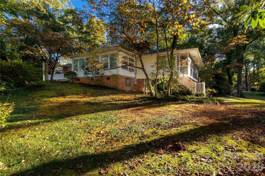 Charming 1954 Home with Character on a Large Lot in Lancaster, SC

If you’re looking for a home with personality, space, and a serene setting, this 1954 Lancaster home has it all. Sitting on a .93-acre city lot, it offers privacy while still being close to the Lindsey Pettus Greenway, top-rated medical facilities, Hwy 521, Bypass 9, and Hwy 5 — making restaurants, shopping, and doctor’s appointments just minutes away. Indian Land is only 15 minutes, and Rock Hill is just 20 minutes.

Step inside to a spacious living room with a cozy gas fireplace, perfect for relaxing or entertaining. The formal dining room, positioned between the kitchen and living areas, features built-ins and charming planters that add character and function.

The kitchen is full of potential with space for a table, a dishwasher, and original vinyl flooring that adds nostalgic charm. Thoughtful details like hallway built-ins and a laundry chute make everyday life easy.

Enjoy your morning coffee in the sunroom or unwind on the screened porch, the real MVP of the home, overlooking a private backyard and peaceful creek — picture a serene, storybook setting right in town.

All bedrooms are generously sized, offering comfort and flexibility. The basement is a large open space with a walk-out patio, ready for a gym, workshop, playroom, or anything your lifestyle calls for.

This home is perfect for buyers searching for Lancaster SC homes with character, screened porches, large lots, and convenient access to highways and amenities. With classic charm and endless potential, it’s a must-see!