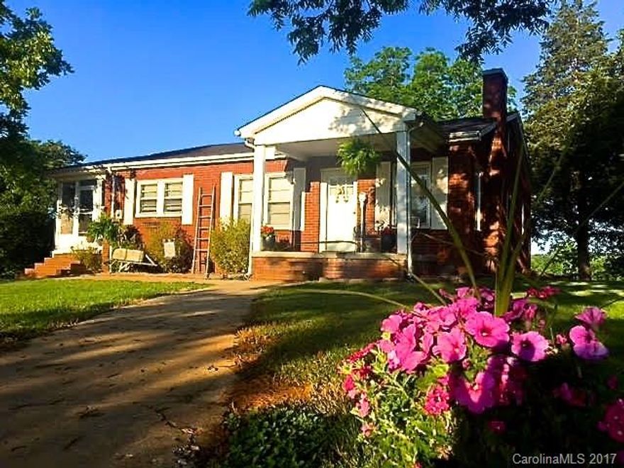 Quiet country setting with long range views, Well decorated 1953 farm house. Just outside city limits and convenient to schools, shopping, Norwood, Lake Tillery, Rocky River & golf. Buyer to survey home with 5+- acres from current 20+- tract.  Easement for access to remaining 15 acres required. .Refrigerator and Flat Screen TV convey, wood stove in basement does not convey. Railroad track is over 1/4 mile away. size/shape of land is negotiable from 1 to 20+_ acres. County has no septic records