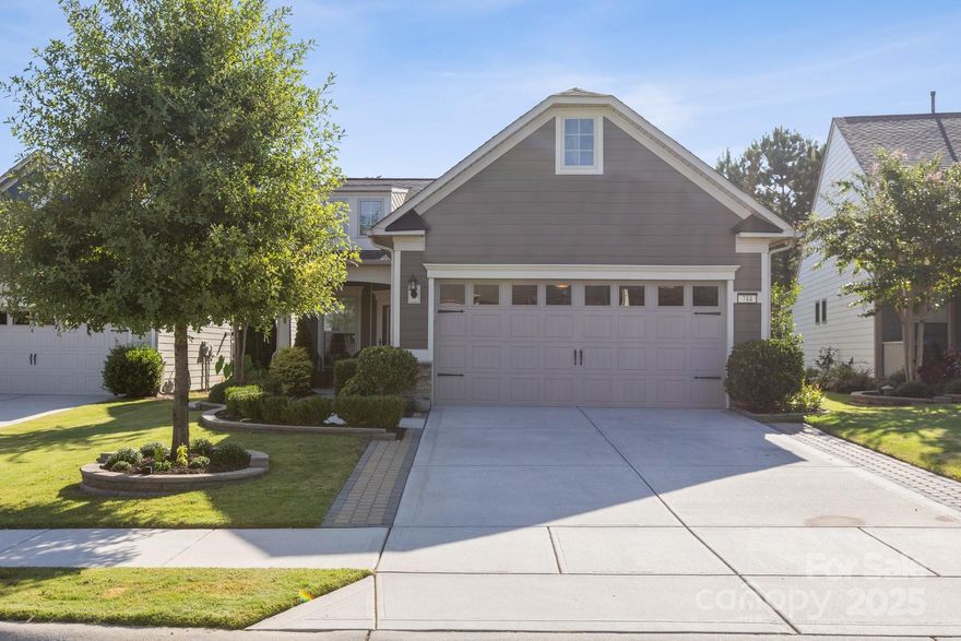 Welcome Home!
This beautifully maintained 2-bedroom, 2-bath home offers a bright, open plan designed for easy living and entertaining. The living, kitchen, and dining areas flow seamlessly into the sunroom, which overlooks the custom backyard retreat.
The primary suite has a tray ceiling and a sliding door to the en-suite bath, double vanities, a tiled shower, and a custom walk-in closet. A second bedroom and full bath provide flexibility for guests or a home office. The open kitchen includes a large granite island, a farm-style sink, 6-burner gas cooktop, double ovens, a new dishwasher, and a whole-house filtration system.
 Off the sunroom is the HEART of this home: the custom-designed outdoor living space with multiple seating zones. The patio extends to the outdoor kitchen with a built-in grill, separate griddle, and a prep space. The private hot tub creates the perfect spot to unwind. At the center is the circular stone fire pit with built-in seating. Surrounded by perennial plantings and with no homes behind you, it's the perfect setting for gatherings or quiet evenings under the stars. The 2-car garage has an industrial stainless steel sink, insulated doors, overhead storage, ceiling fan, and a floored attic.
Located in a sought-after 55+ active adult community, you'll enjoy resort-style amenities such as an indoor and outdoor pool, fitness center, tennis and pickleball courts, social clubs, meeting rooms, sidewalks, amenity center, and more.