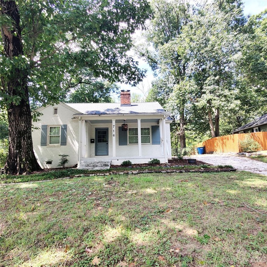 Charming home in beautiful downtown Ft Mill, located across street from Harris Park and greenway trails.  Gorgeous setting on 1/3 acre with welcoming large front sitting porch, huge back deck and fenced yard with firepit.  Beautiful new wood floors and fine Craftsman-style detailing throughout.  Kitchen has been beautifully updated w granite countertops, white shaker cabinets, mosaic tile backsplash, farm kitchen sink and stainless steel appliances.  Separate dining room has gorgeous exposed brick wall.  Lots of natural light in every room, plus pretty updated light fixtures throughout.  Huge living room with wood burning fireplace. 2 very spacious bedrooms.  Charming bathroom w painted tile floor, subway tile surround in tub/shower, and wainscoted paneling.  Harris Park offers playground and picnic areas.  Easy access to shops and dining in downtown Ft Mill, Kingsley, Baxter & Riverwallk.