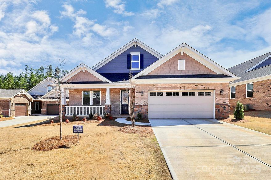 Experience modern design and refined comfort in this beautifully appointed 5-bedroom, 4.5-bath home in sought-after Mint Hill. Located in a low-maintenance, all-brick community, this residence offers an open-concept layout filled with natural light and designer finishes. The gourmet kitchen features upgraded stainless-steel appliances, stone countertops, a large island, and custom cabinetry. The main-level primary suite provides a serene retreat with a spa-inspired bath, dual vanities, a walk-in shower, and a spacious closet. Upstairs includes a flexible bonus room ideal for a media space, office, or recreation area. Convenient to shopping, dining, and major roadways, this home blends elegance, function, and exceptional craftsmanship.