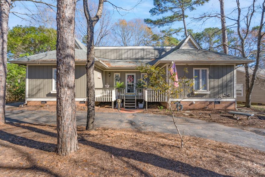 Lovely ranch home and updated beautifully.   This home has a front porch with room for  outside sitting and as you enter the foyer, the updated kitchen has  beautiful cabinetry, new appliances, flooring and a great bar area overlooking the breakfast area.    Open kitchen looks into the greatroom with a gas fireplace.   There is an oversized deck with space to entertain a large number of guests.   As you enter the back yard, there is a storage building or workshop that could be used even for a child's playhouse.   This home is gracious and inviting.