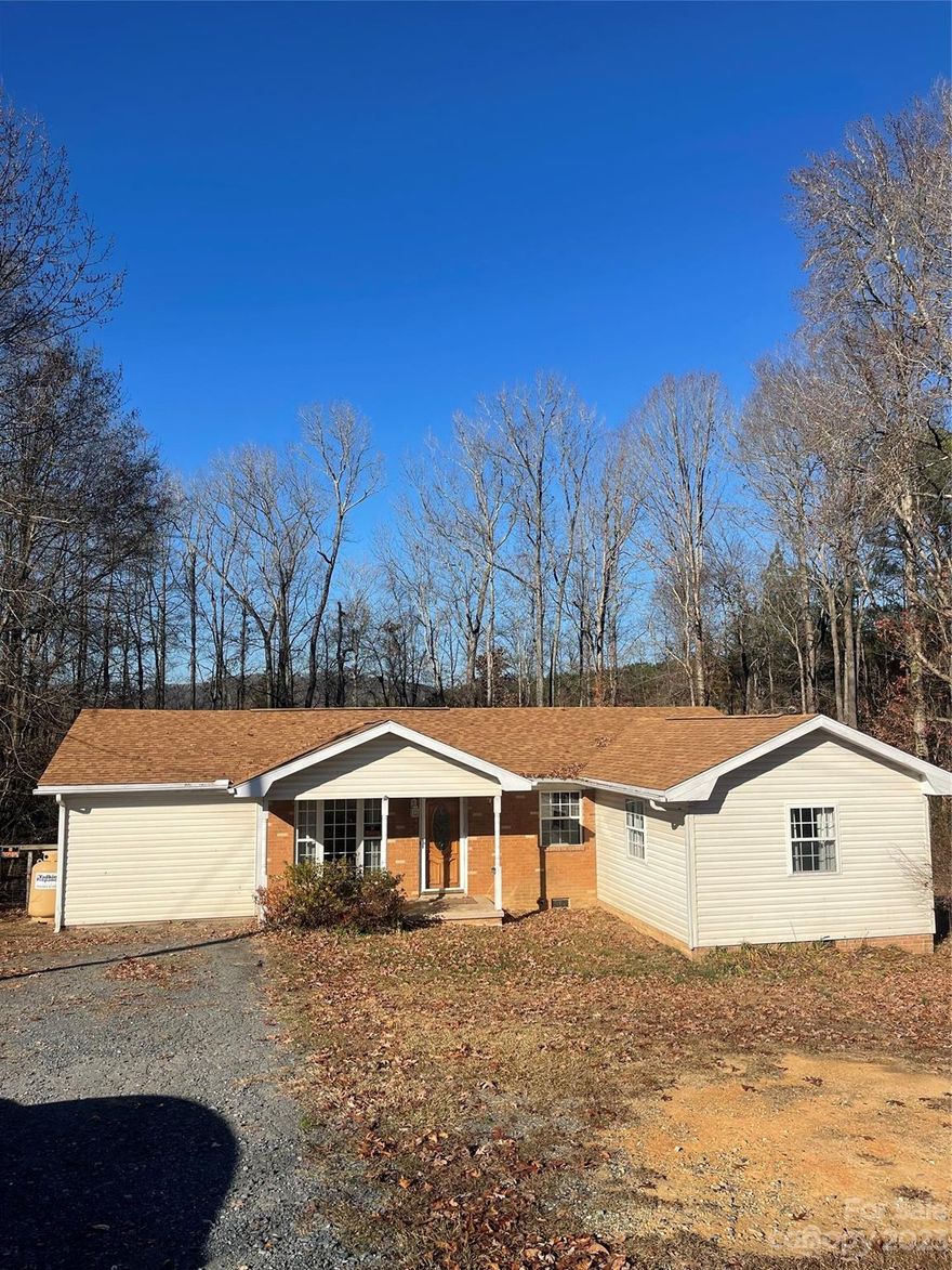 North Carolina Living in this charming vintage 3 bedroom, 1 bathroom ranch styled Home. Property has fantastic potential for a modern transformation. Includes a beautiful backyard deck to enjoy the view of the mountains as the leaves fall. Located close to Uwharrie Mountains with access to Lake Tillery, Uwharrie National Forest, Badin Lake, Flintlock Shooting Range, and more. The home has central cooling and for heat has a heat pump and has been plumbed for propane wall heater in the living room.  Please note that the home is being sold as-is. As responsible buyers, it is imperative that you thoroughly investigate any aspects you deem significant.