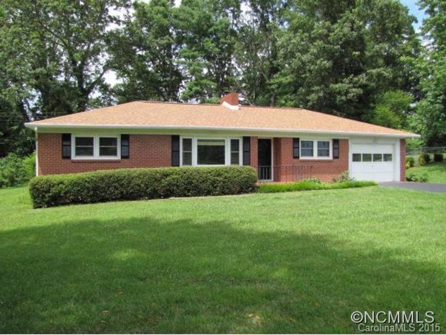Great Mid Century Rancher in beautiful and established Grimesdale community. This 1958 all brick home features oak hardwood floors, an open floorplan, large picture windows, and updated windows throughout. Additional highlights include 1 car garage, full basement, partially fenced back yard, and gorgeous level half acre lot. Just mins to Hendersonville and easy access to I-26.