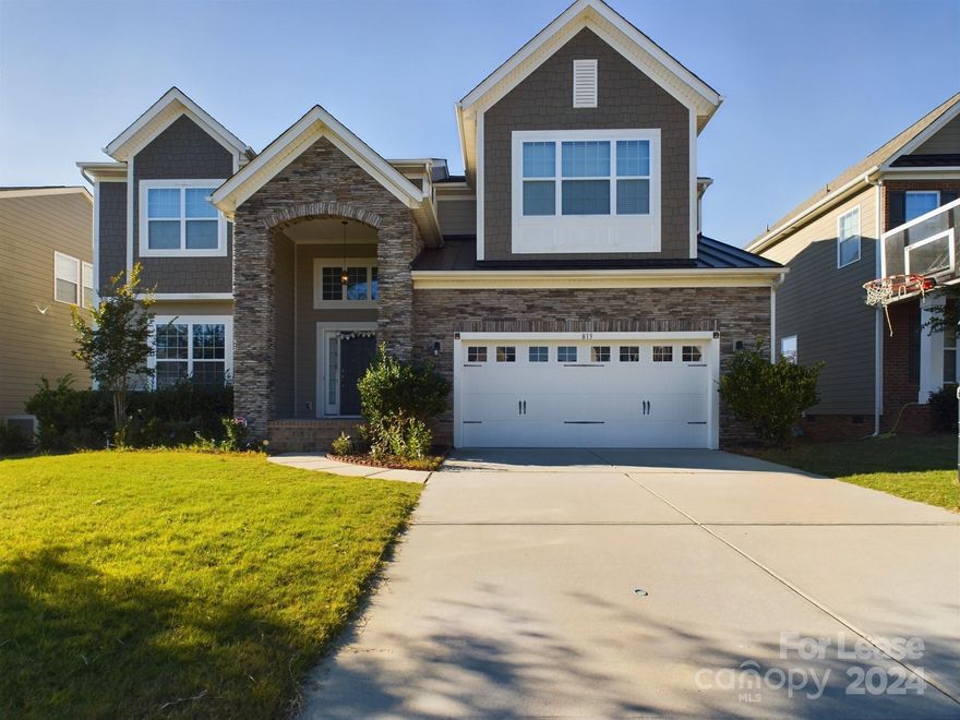 Upgraded, engineered flooring on the main, entryway w/ crown and chair molding, formal living/dining Room with chair and double crown molding & tray ceiling , surround sound and tons of upgrades in this stunner. The gourmet kitchen features custom cabinetry, granite countertops, island/breakfast bar, SS appliances, tile backsplash, butlers pantry, walk-in pantry & casual dining area. This home is perfect for entertaining! This home also offers a guest suite on main with a full bath. The upstairs features a huge loft, the owner's suite with his and her vanities, beautiful tile shower, 2 additional bedrooms, guest bath w/ dual sinks, and large laundry room. The fenced in backyard has a large beautiful entertainment area with gorgeous pavers. The garage has epoxy floors and built in storage. Neighborhood Pool. Award-winning schools & low taxes!