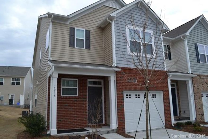 Beautiful, better than new end unit townhome.  Many upgrades like crown moldings, light fixtures, hardwood floor on main level.  Granite kitchen with sandwich bar, stainless appliances, gas range and refrigerator.  Dining area, great room with fireplace / gas logs.  Huge master with tray ceiling and walk-in closet.  Laundry room located upstairs with the bedrooms.  Elementary school is located inside the community!  Community also has a swimming pool!