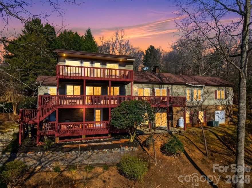 Set on 3.7 acres along the shores of Lake Hickory, this exceptional waterfront property offers space, privacy, and effortless lake living. The home features four bedrooms & 4.5 baths, along with a separate second living quarters, in the basement, complete with a full kitchen and an additional bedroom & bath—ideal for extended family or guests (septic permitted for four bedrooms).
Designed to embrace the outdoors, the property boasts 3 decks for outdoor living areas across three levels, creating multiple spaces to relax, entertain, and enjoy panoramic lake views. Inside, the spacious dining and living areas are filled with natural light, offering a warm and inviting setting for everyday living and gatherings alike.
A covered two-slip boat dock with boat lifts provides direct access to the lake, making boating and water recreation easy and convenient. This rare Lake Hickory offering combines generous acreage, versatile living spaces, and exceptional waterfront amenities—perfect for creating lasting memories or a private lakeside retreat.