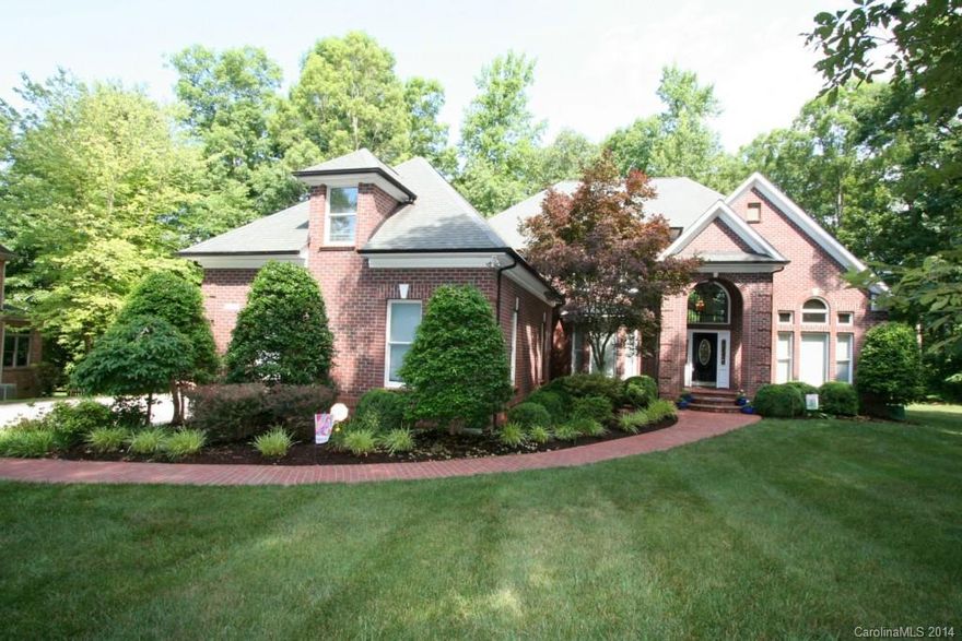 Beautiful full brick home on over an acre. Open floor plan features updated kitchen w/granite countertops &   Jenn Air glass cooktop. Hardwoods on the main floor, master on main, large bedrooms up, dual staircase, fresh paint, large bonus, gas logs, tankless water heater, new roof, awning covering brick patio overlooking private yard. A stunning home in great condition.