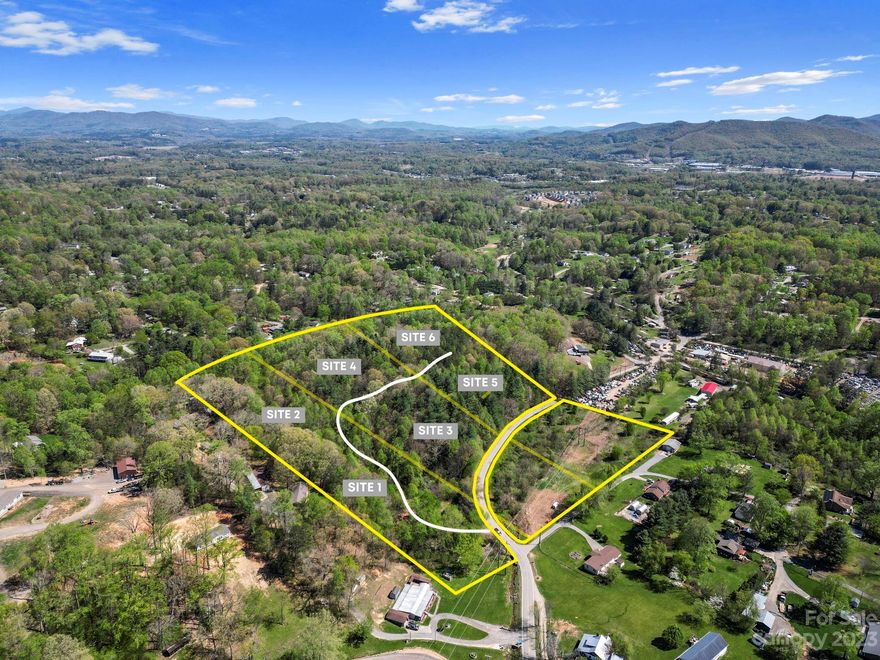 Private and wooded land that lays very well. This land has already been split into 3 separate approximately 5-acre parcels for sustainable development. There is a site plan for 6 properties total which are preliminarily approved with a short-term rental complex permit. This is located just outside of the city limits. Great proximity to anything you might ever need! The gorgeous creek flows year round and offers a unique experience and fun amenity next to flat level land to play and enjoy the mountain lifestyle. Request from listing agent details on Special Use Permit, Stormwater Plan, construction Budget, Survey with Placed Homes, Floor Plans, Proformas, and Renderings.