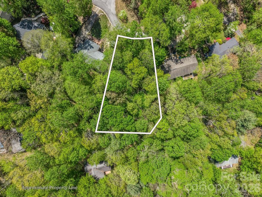 “A lot” that truly has it all!

This accessible, buildable homesite is ideally situated in a prime location, offering the best of South Asheville and Arden conveniences just minutes away. Spanning approximately 0.33 acres, the gently sloping terrain provides an excellent foundation for your future home—without the hassle of steep or difficult access (no 4x4 required).

Tucked away on a quiet cul-de-sac, the property offers both privacy and potential, including the opportunity for long-range, northwest-facing mountain views—perfect for taking in stunning sunsets.

Utilities are available (septic needed), and a survey is forthcoming. Located in a desirable neighborhood with minimal covenants and restrictions, this is a rare opportunity to secure a homesite with flexibility and value.

Lots like this are becoming increasingly hard to find—don’t miss your chance. Bring your offer today.
