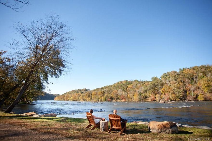 Olivette Riverside Community & Farm is a thoughtfully planned community featuring a working farm, community gardens, walking trails, a 7-acre riverfront park including a pavilion & fireplace, fire circle amphitheater, suspended bridge to a private island, and labyrinth. This lot has a level build site and perc test for a 3 BR and has both long range mountain and French Broad River views. Olivette is only 6.7 miles from Downtown Asheville.