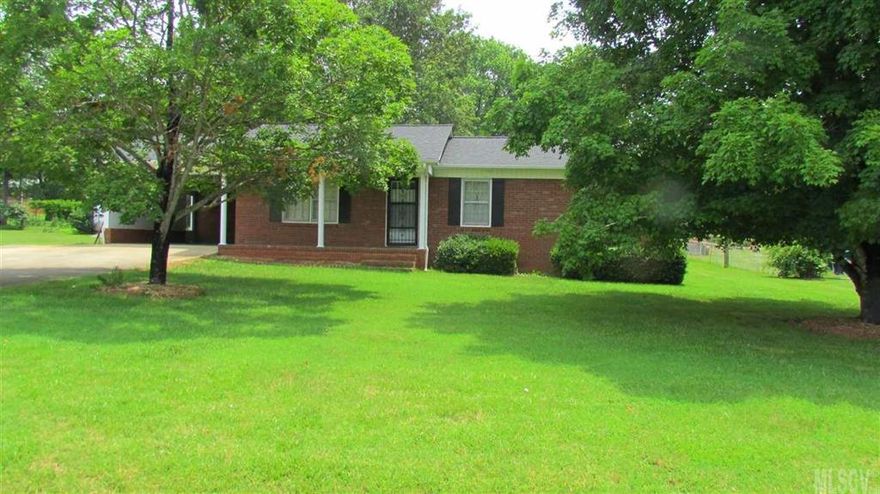 Brick ranch with level lot, two outbuildings, Lg garden area, covered front porch, covered area for boat or tractor, carport, updated heat pump, convenient to 115 and Hwy 21-N! This well maintained home offers 3 BR 1.5BA dining area that leads out to a cozy sunroom, kitchen equipped with appliances that remain for a new buyer, and a large living room with two windows overlooking the front yard. The yard is shaded with several mature trees. The carport is good sized and will fit a car or truck. If you are a buyer looking to downsize or just starting out and want an affordable home in a convenient area you'll want to put this home on your list! Easy to view and move in ready. 150 Devon Lane Statesville NC!