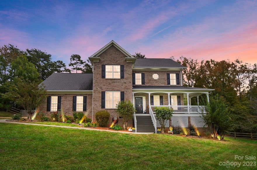 Welcome to Oxfordshire a mature landscaped full brick neighborhood in Mint Hill.  Wrap-around front porch is waiting for you and it sits on a quiet Culdesac street.  Step inside to tasteful colors, tile flooring & hardwoods.  The dining rm is accented with crown molding & wainscotting. Sunlit living room. Family rm with gas fireplace & updated mantle & surround is the perfect open concept. Designer kitchen you will fall in love with. Huge island with new appliances (Zline 36" dual fuel range) cabinets & countertops. Enjoy evenings on a 2 tiered private deck. Powder rm & laundry rm complete the main level.  Upstairs find 4 bedrooms & a bonus room.  The primary suite has a walk-in closet you will love. Hardwoods throughout the bedrooms. The basement is finished with a half bath & huge storage closet. All appliances, pool & air hockey table convey with an acceptable offer.