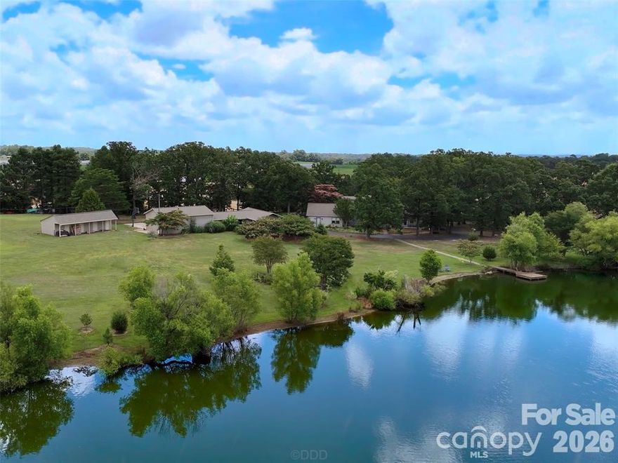 Wow! Stunning Lakefront Estate on Almost 14 acres in the Sought-After Piedmont School District!
This one-of-a-kind property offers privacy, space, and breathtaking views from every angle. A long, tree-lined driveway welcomes you to your own private retreat, leading to a beautiful covered deck overlooking a serene, spring-fed and fully stocked lake—complete with a custom stone smoker, perfect for entertaining and relaxing outdoors.

The property is a dream for hobbyists, nature lovers, or anyone seeking a multi-use estate. Outdoor highlights include a 4-stall Building, chicken coop, RV site, farmed field along driveway, plus 7 acre farmed field, detached 2-car garage, plus pass-through garage, workshop, and an additional 3-car garage with 200-amp service and a wood stove—offering endless possibilities for projects, equipment, or small business use.

Inside, the home features a chef’s kitchen with a Viking range, Corian counters, ample cabinetry, and an enormous pantry. The vaulted living room and vaulted game room showcase gorgeous natural light, a stunning 2 story wood-burning stone fireplace, and beautiful lake views that bring the outdoors in.

The main level also offers a spacious primary suite, plus two additional bedrooms, a full bath, and a flexible in-law or business suite with a private entrance—ideal for guests, a home office, or multi-generational living.

Upstairs, you’ll find two more large bedrooms and another full bath, providing plenty of space for everyone.

Whether you’re seeking a peaceful country retreat, an entertainer’s dream, built additional homes or a functional homestead with modern comforts, this property truly has it all. Come relax by the lake, watch the sunset from your deck, and experience the perfect blend of tranquility and luxury.