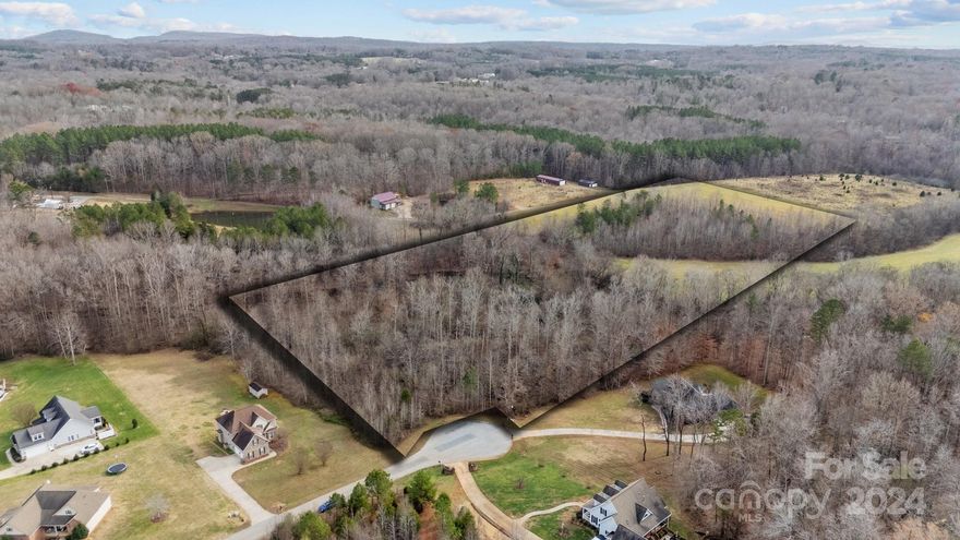 Discover the perfect place to build your dream home on this stunning 5.09-acre lot, ideally located at the end of a quiet cul-de-sac in a peaceful, established neighborhood. Surrounded by mature trees and natural beauty, this private homesite features a picturesque creek that runs through the middle of the property(Flood zone), creating a serene and unique setting. With approved building and septic permits (2022) for a 4-bedroom home (no basement), it's truly ready for your vision. Whether you're dreaming of a custom retreat or a spacious family home, this property offers the rare combination of space, privacy, and build-ready convenience. Don’t miss this unique opportunity to own a piece of nature while staying close to modern amenities — schedule your visit today!