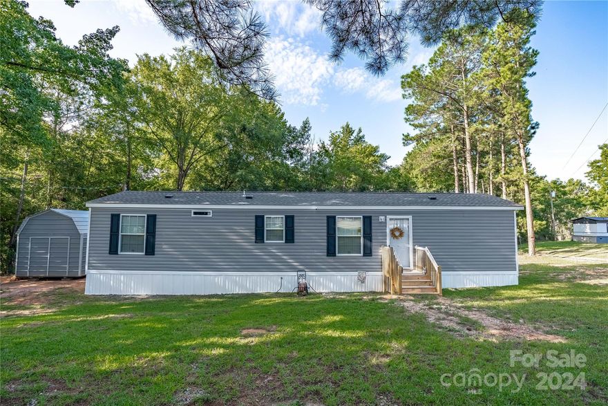 Experience the charm of this like-new 2024 mobile home, featuring 2 cozy bedrooms and 1 modern bathroom. Nestled in a semi-private setting, this home offers a tranquil escape while still being close to all the conveniences you need. The fully equipped kitchen and laundry area come with all appliances, including a washer and dryer, making your move-in effortless. Additionally, the backyard shed comes with a lifetime warranty and a double loft, perfect for extra storage or a creative space. No HOA! This delightful home is ready to welcome you!