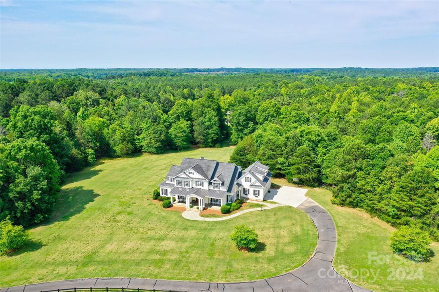 A York county sanctuary for you & your farm animals.This equestrian property offers privacy, scenic pastural views, wood shade areas & a custom quality built Southern Builder's home. Imagine a setting where all your friends will want to have their daughter's wedding. A large rocking chair front porch overlooks the animals grazing in the pastures, a screened-in porch & patio open up to a large back yard ready for your pool, putting green, tennis court or guest/in-law's home. Thoughtfully designed for indoor/outdoor living. Pine or tile flooring throughout & a large mud room/drop station w/side entrance & wall of built-in's. Privacy for everyone, all ensuite bedrooms, 2nd flr bonus room & private main floor office. Entertain guests in style in your gourmet kitchen. The farm features a 4-6 stall barn w/concrete center aisle, tack room, wash stall & all the perks. 80'x200' arena & round pen w/great footings. Low maintenance HDPE & Ramm fencing. Perimeter fence & trails round out the farm.