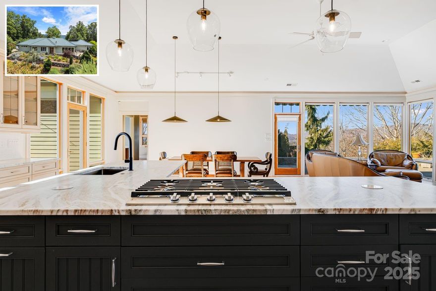 NEW UPDATES This view is why people move to the mountains, and it’s breathtaking from every room in the home. Enjoy sunsets over Mt Pisgah & Cold Mountain. Mahogany front doors lead into the great room with tray ceilings & expansive vistas through a wall of windows. A flagstone patio overlooking beautiful gardens, meandering stone paths & captivating views. NEW elegant Chef's kitchen with subzero refrigerator, Fisher-Pakel dish drawers, large butler pantry replete with wall oven/warming drawer & add'l refrigerator.  Custom double sink vanity & 2 walk-in closets w/built-ins grace the primary bedroom with sitting area. Office with marble floors/counters & more views! Large ensuite 2nd bedroom & den/bonus room. 3rd bedroom & full bath downstairs plus 2nd living quarters/apt w/separate entry, granite counters, laundry, large bedroom, walk-in closets. All beautifully finished. This private 11.47 acre sanctuary is only minutes from Asheville and every convenience.