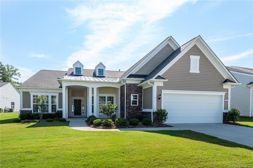 Gorgeous Cumberland Hall w/ 3-Season room in 55+ Sun City Carolina Lakes Community. Open floorplan features eat-in kitchen w/ SS appliances-including cooktop gas stove & wall oven, island & serving bar, dining nook & pantry. Formal dining room opens to light-filled great room w/ corner fireplace. Plantation shutters & hardwood floors throughout the entire home. Luxurious master suite features wall of windows, custom WIC, & attached bath w/ dual sink, vanity & walk-in shower. Like New home!