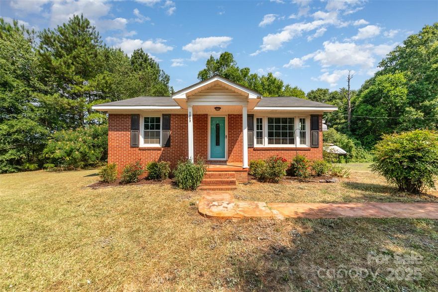 Enjoy peaceful country living just 10 minutes from town! This charming home is tucked away in a quiet setting with NO HOA and sits on just under an acre (.79). Inside, updates include a walk-in tiled shower, tile, and hardwood floors throughout and outside the backyard is private and fully fenced with a shed/workshop. Conveniently located near groceries and dining in downtown Lancaster with easy access to I-77, so you can commute to the Charlotte area within 45 minutes. Whether you're searching for your next home or a smart investment opportunity, this property is full of potential. Don’t miss your chance - schedule a showing today!